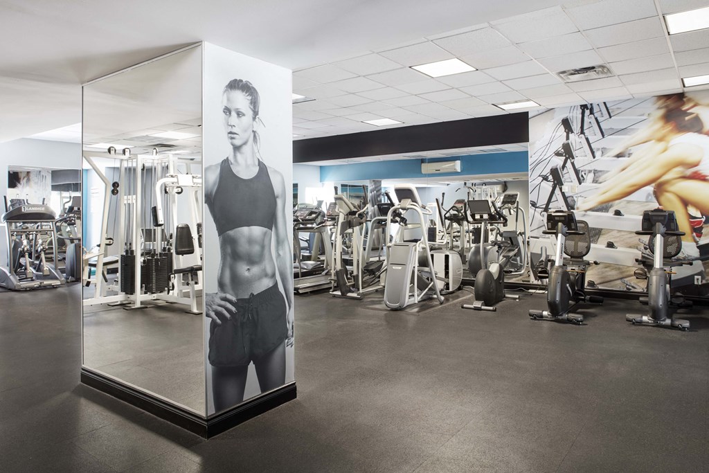 a sign in a gym with a picture of a man on it
