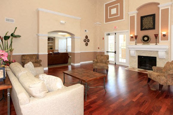 a living room filled with furniture and a fire place