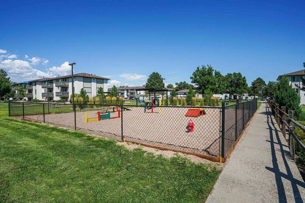 children playing on a volleyball court in a park