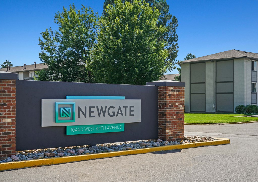 a sign for newgate in front of a building