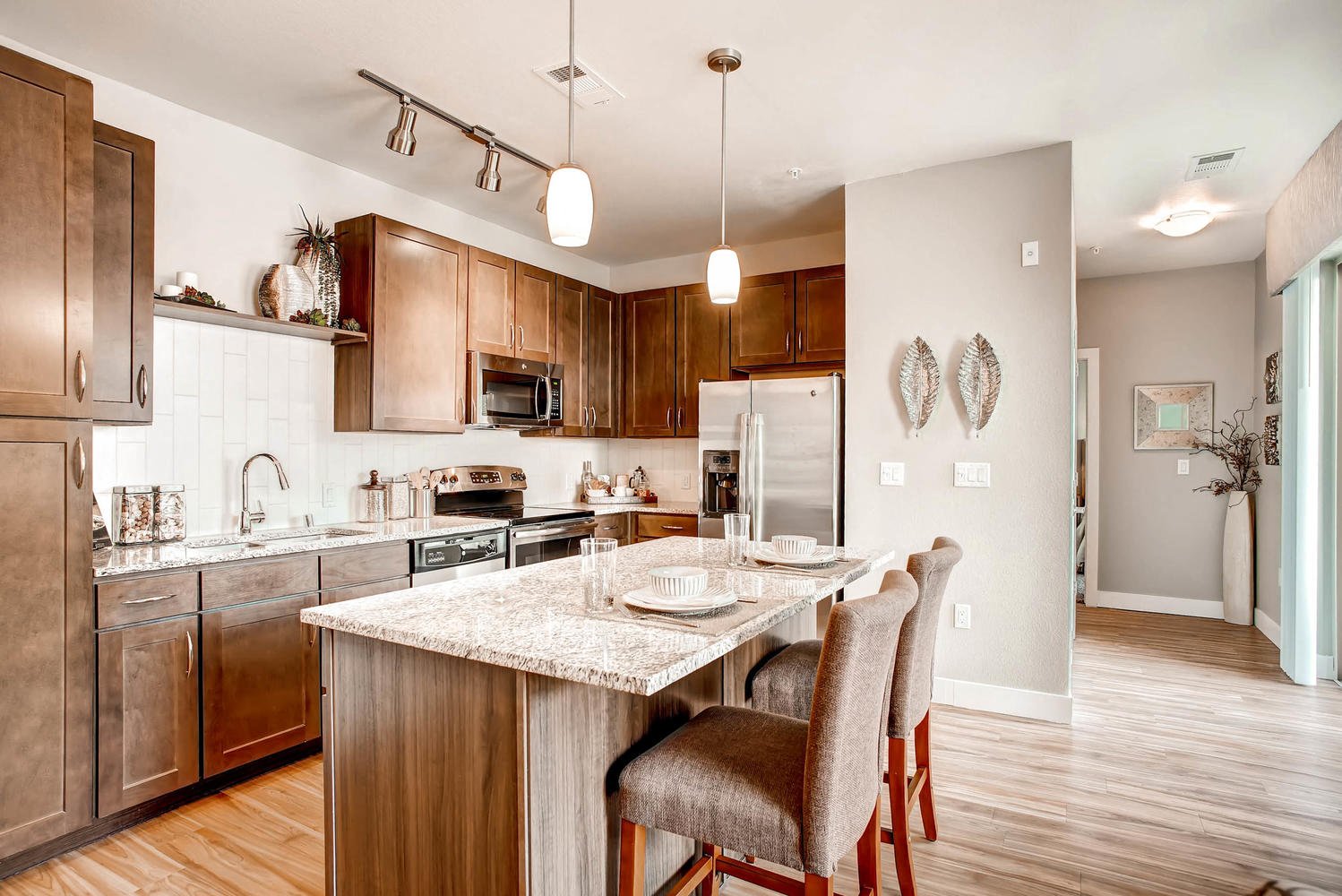 a kitchen with a marble counter top