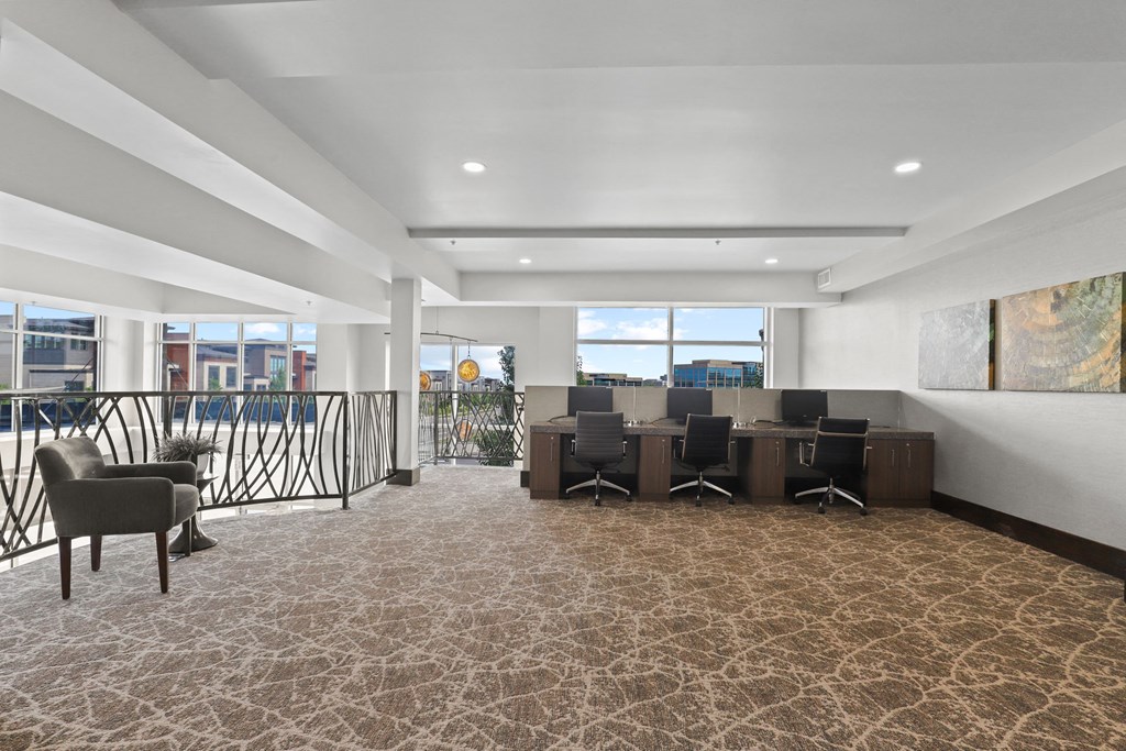 a conference room with a table and chairs and a balcony