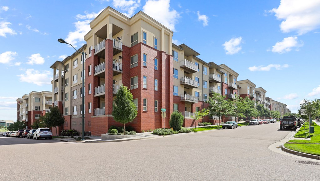 an apartment building on the corner of a street