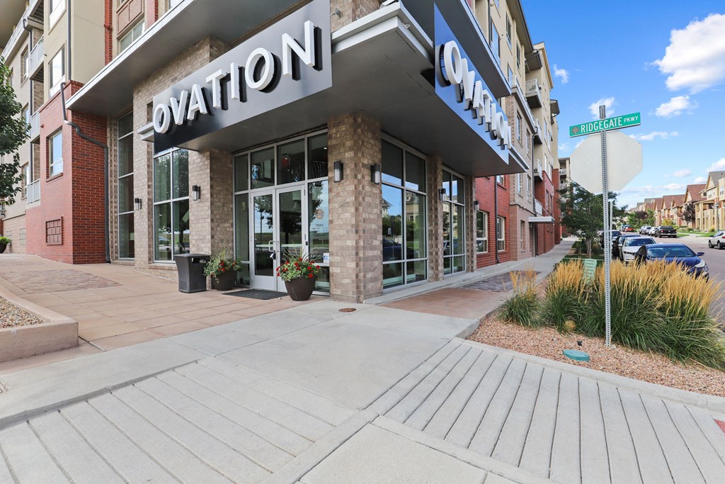 the facade of a building with a sign that reads dominion city