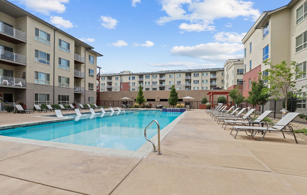 our apartments offer a swimming pool with chaise lounge chairs