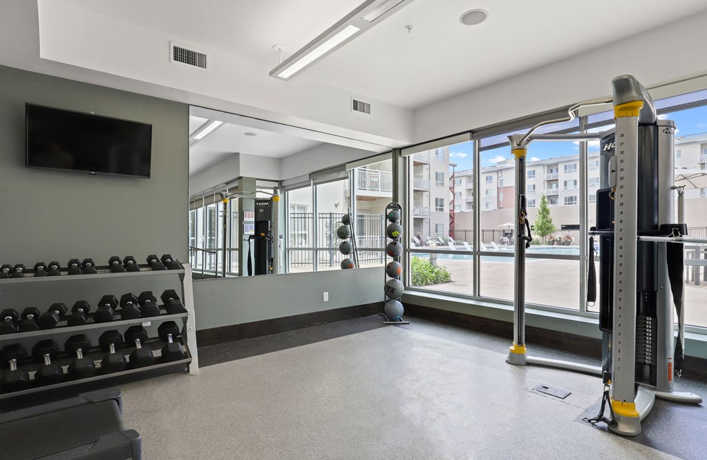 the gym at the flats at big tex apartments