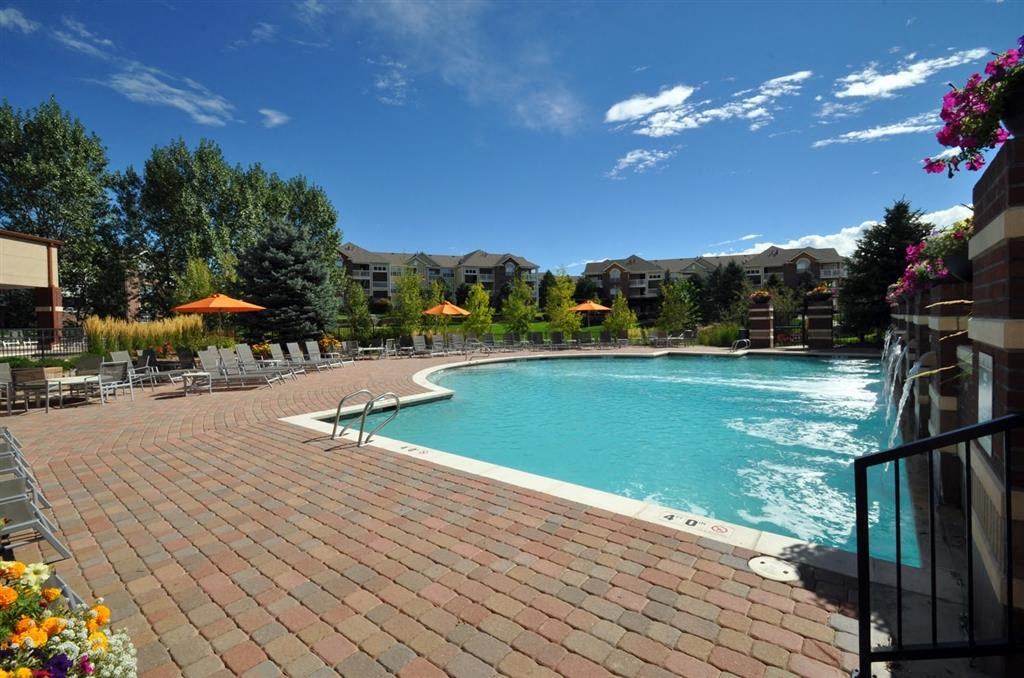 the swimming pool at the resort on a sunny day