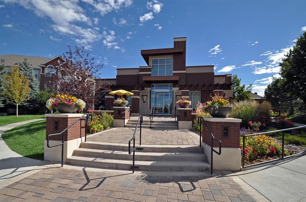 the front of a building with steps and a staircase