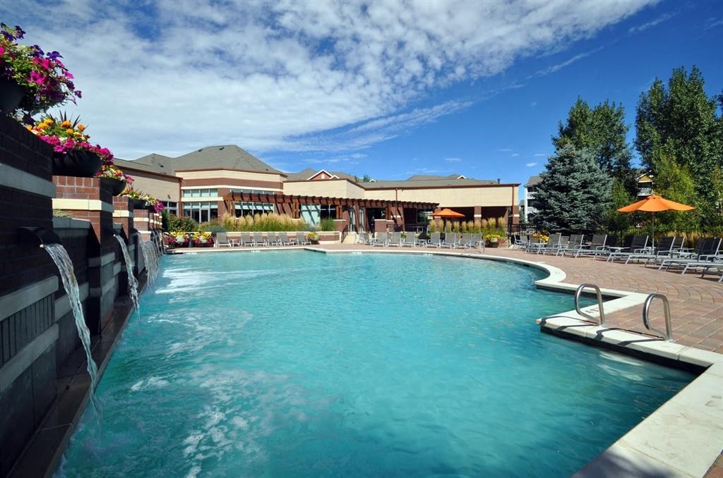the swimming pool at the resort on a sunny day