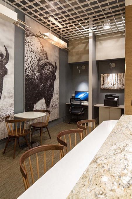 a room with tables and chairs and a counter