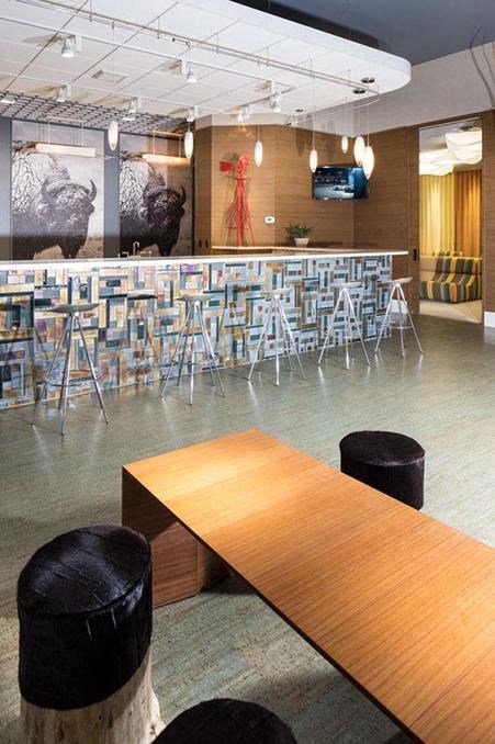 a large room with tables and chairs and a bar