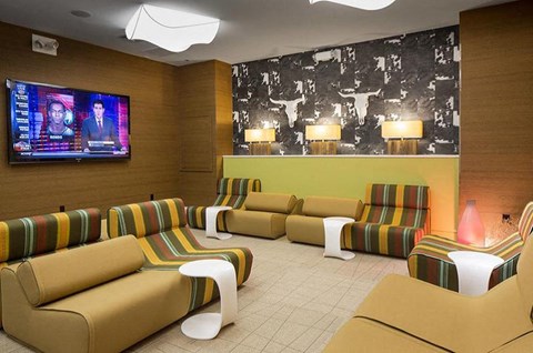 a living room with couches and a tv