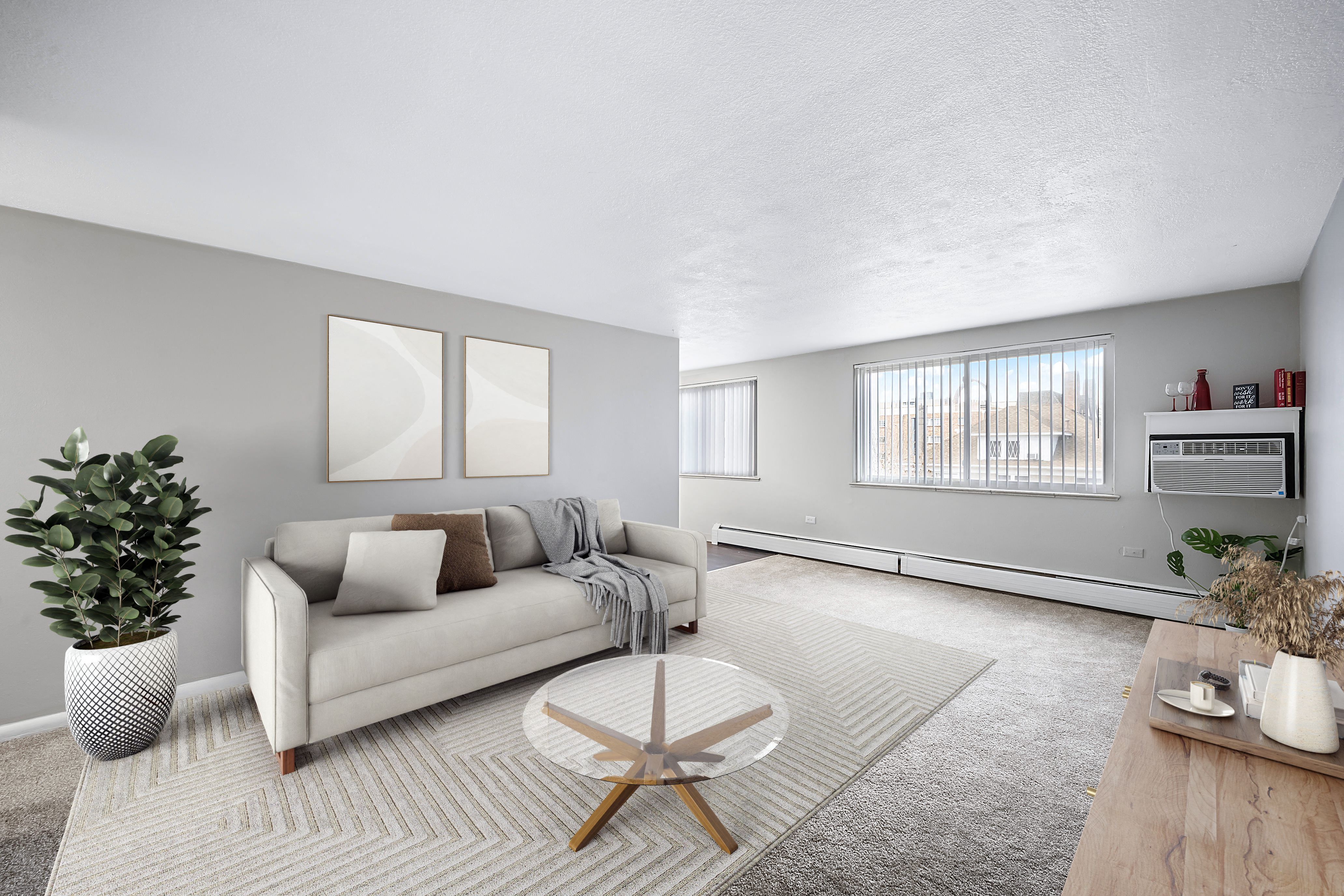 the living room of an apartment with a couch and a coffee table