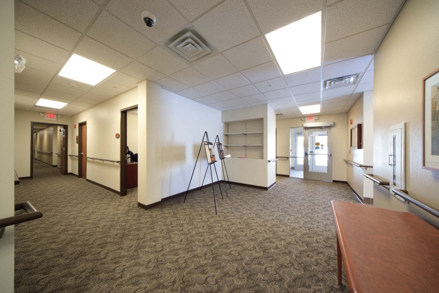 a large room with a table and a tripod in the middle
