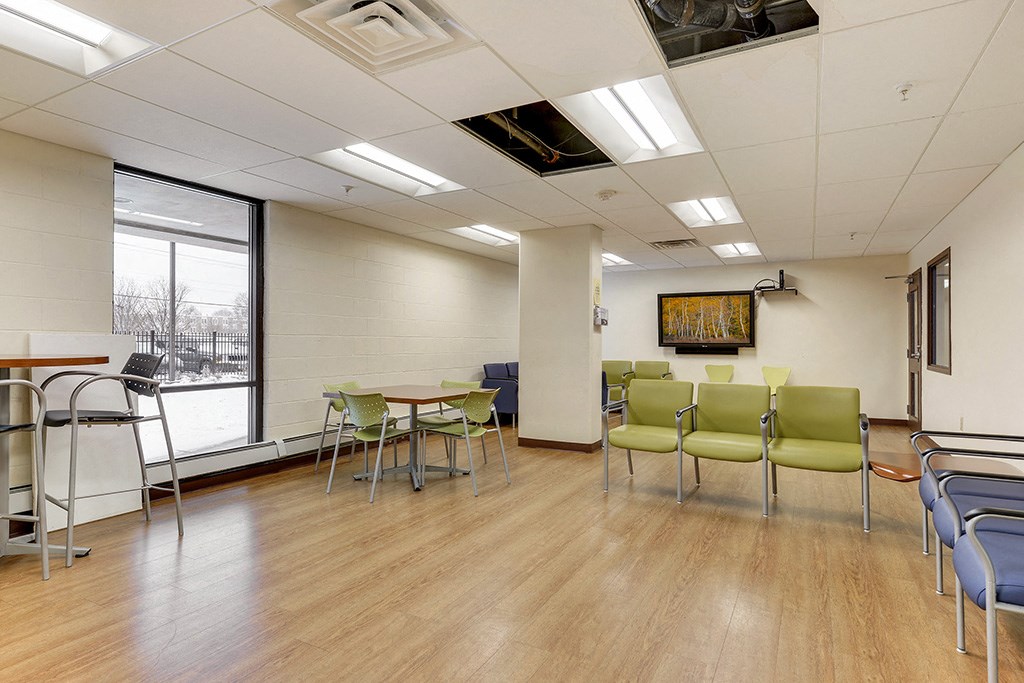 a large room with chairs and tables and chairs