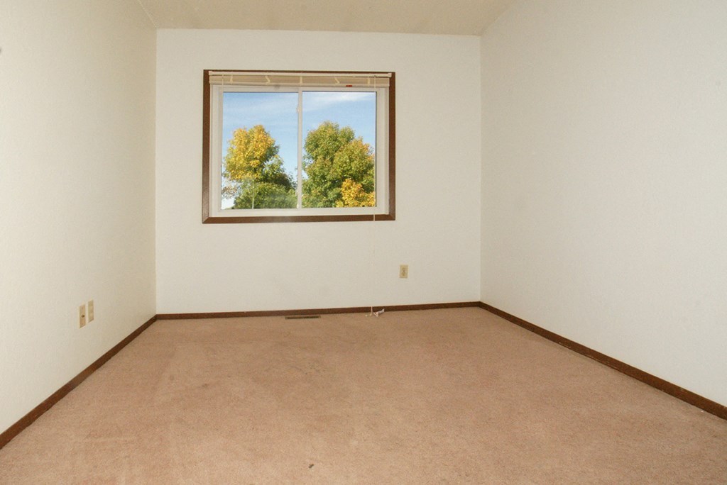 an empty room with a window in it