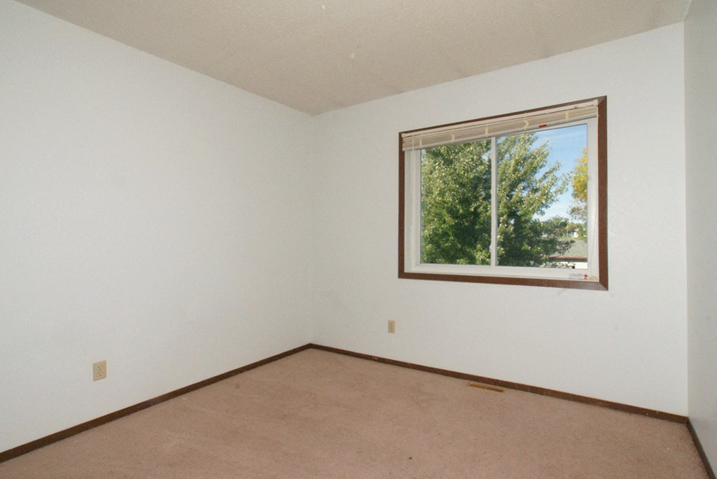 a small room with a large window in it