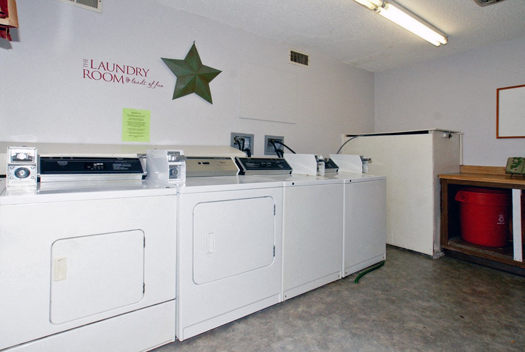 the laundry room is equipped with washers and dryers