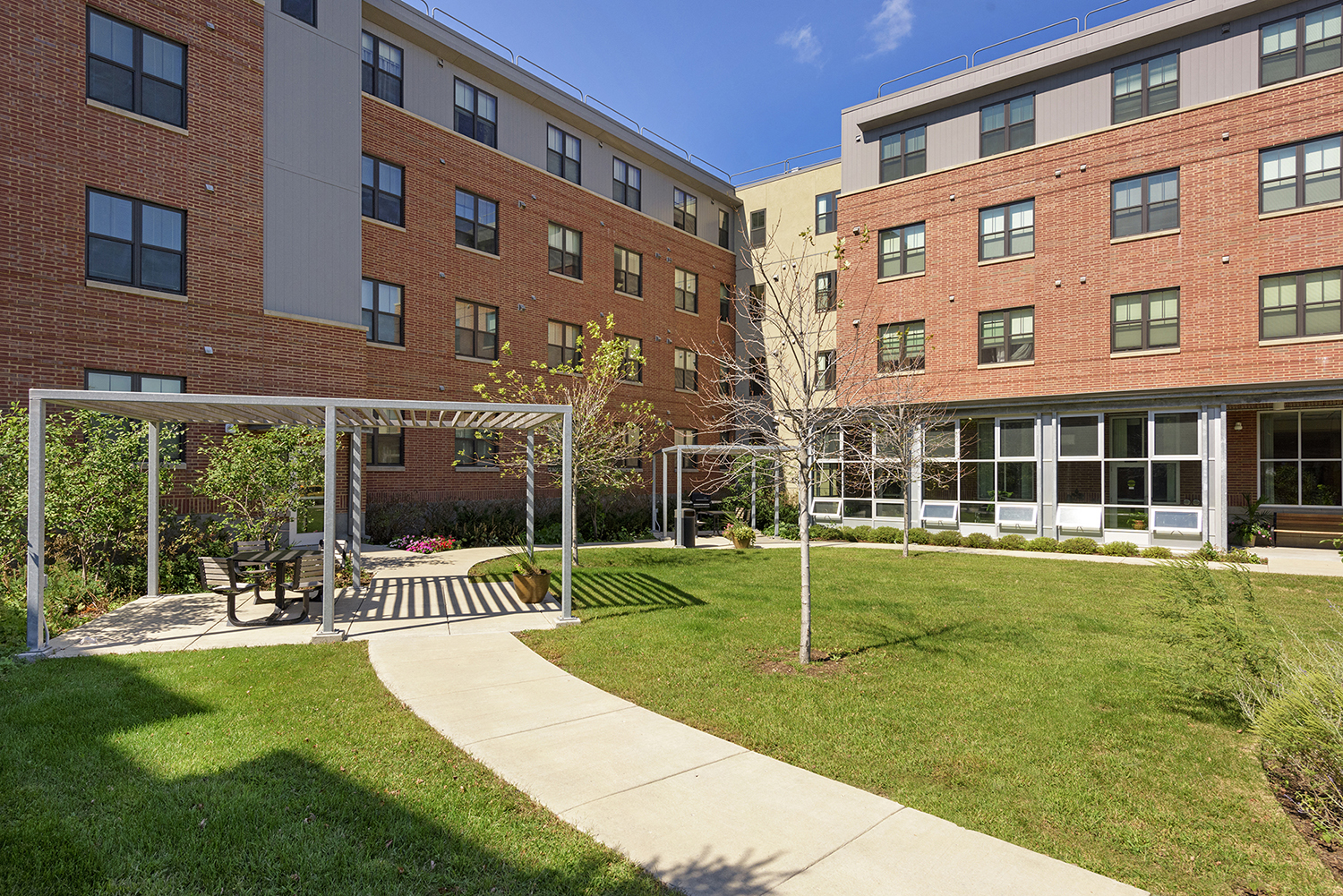 our apartments have a spacious courtyard with swings and a picnic table
