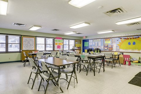 a dining room with tables and chairs