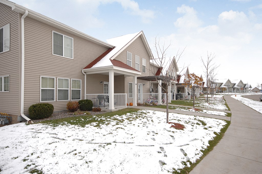 a row of houses in the snow