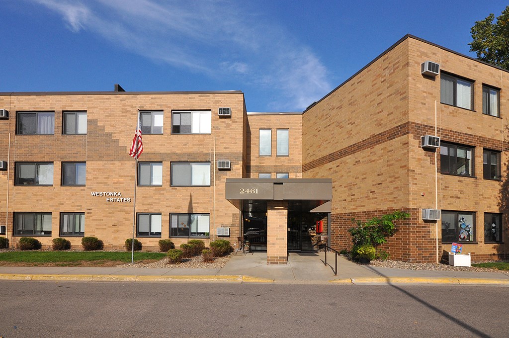 a brick building with an flag in front of it