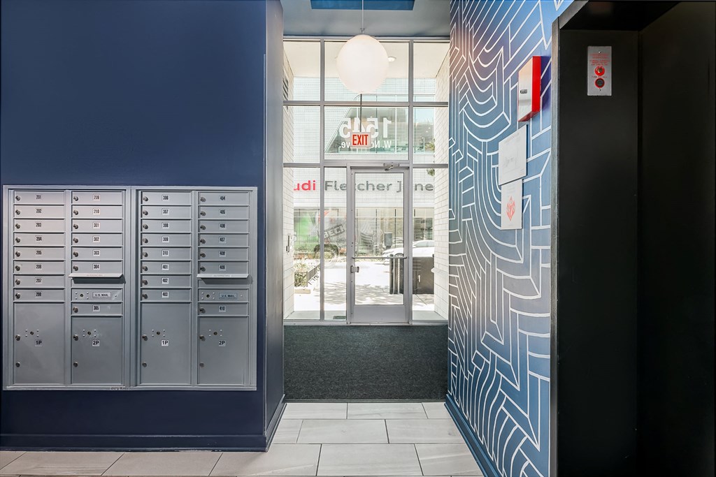 a view of a hallway with lockers and a window
