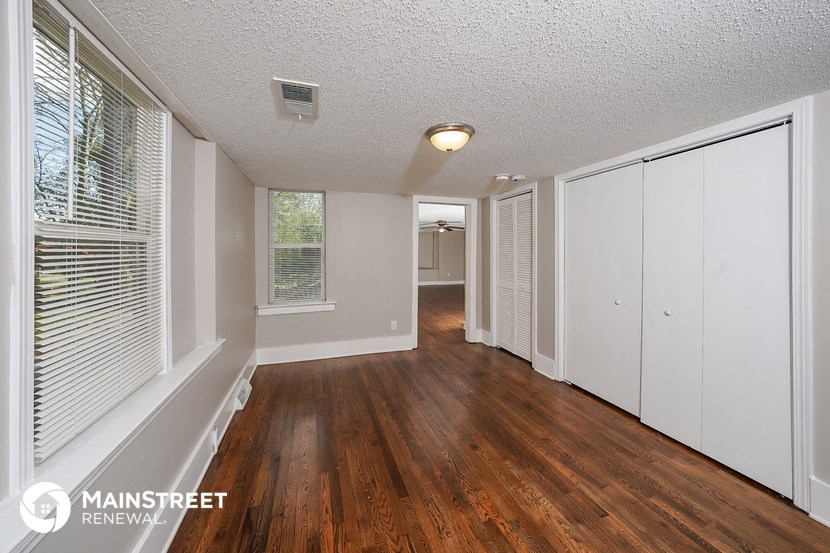 the living room and dining room of an apartment