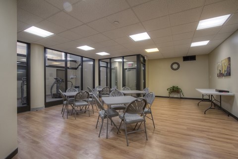 A conference room with a table and chairs.