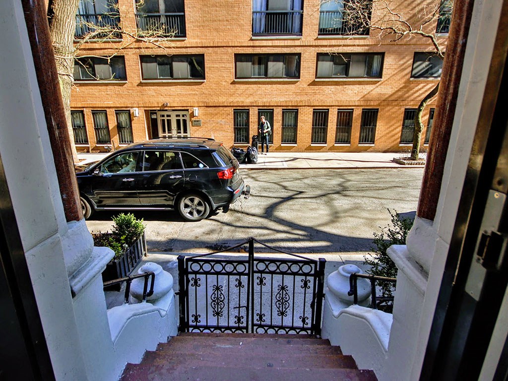 a car parked on a street in front of a building