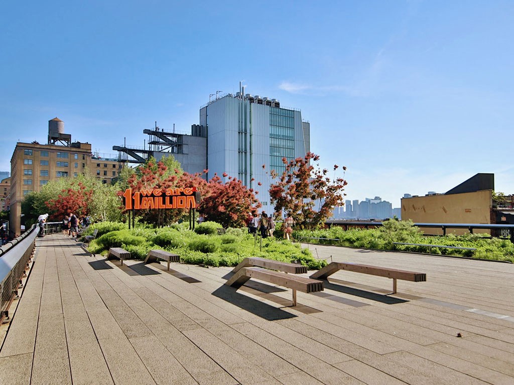 a group of benches sitting on top of a park