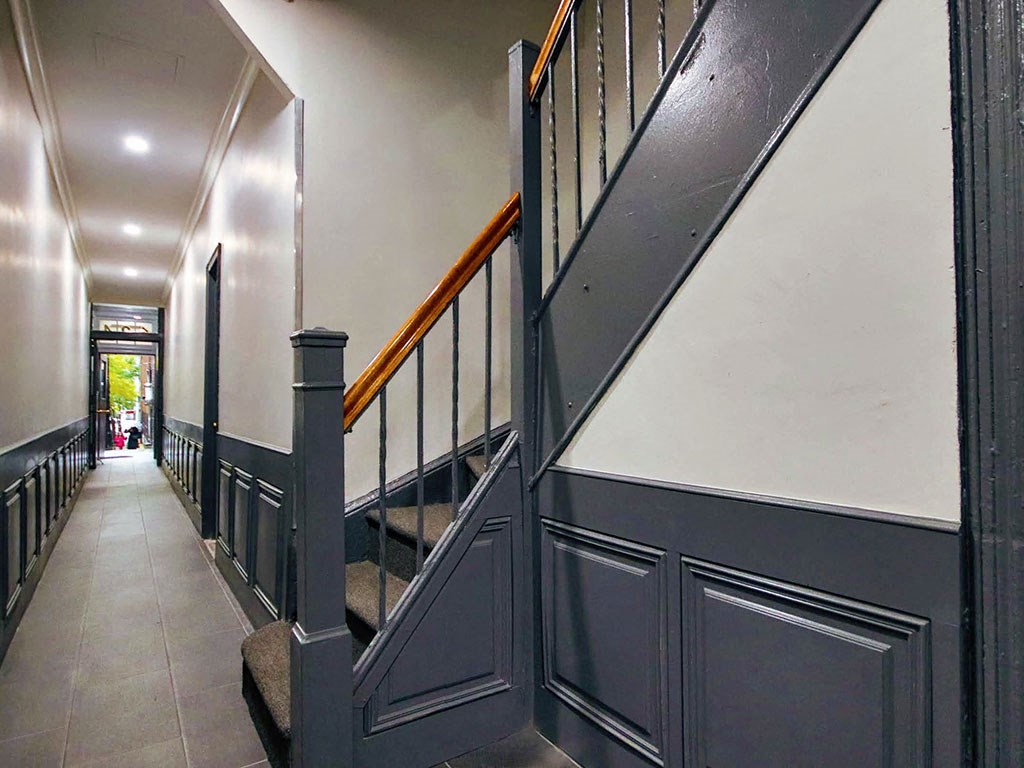 a staircase in a house with black and white walls