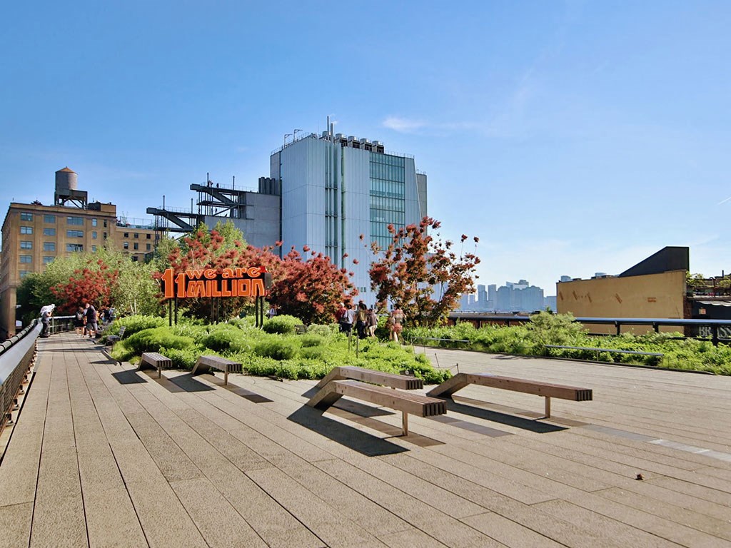 a group of benches sitting on top of a park