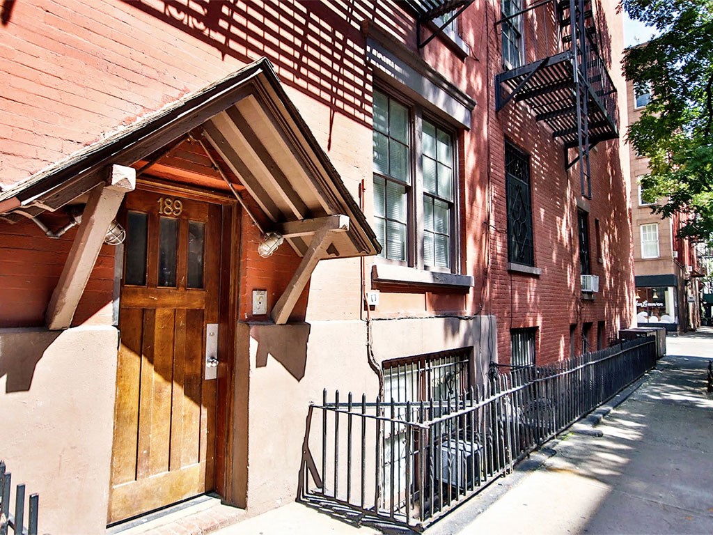an old brick building with a wooden door