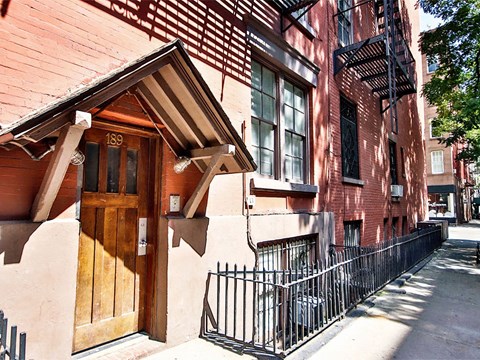 an old brick building with a wooden door