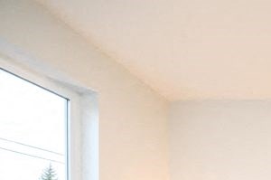 a bedroom with a bed and two lamps
