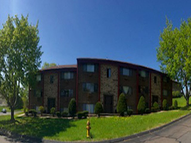 a large house with a fire hydrant in front of it