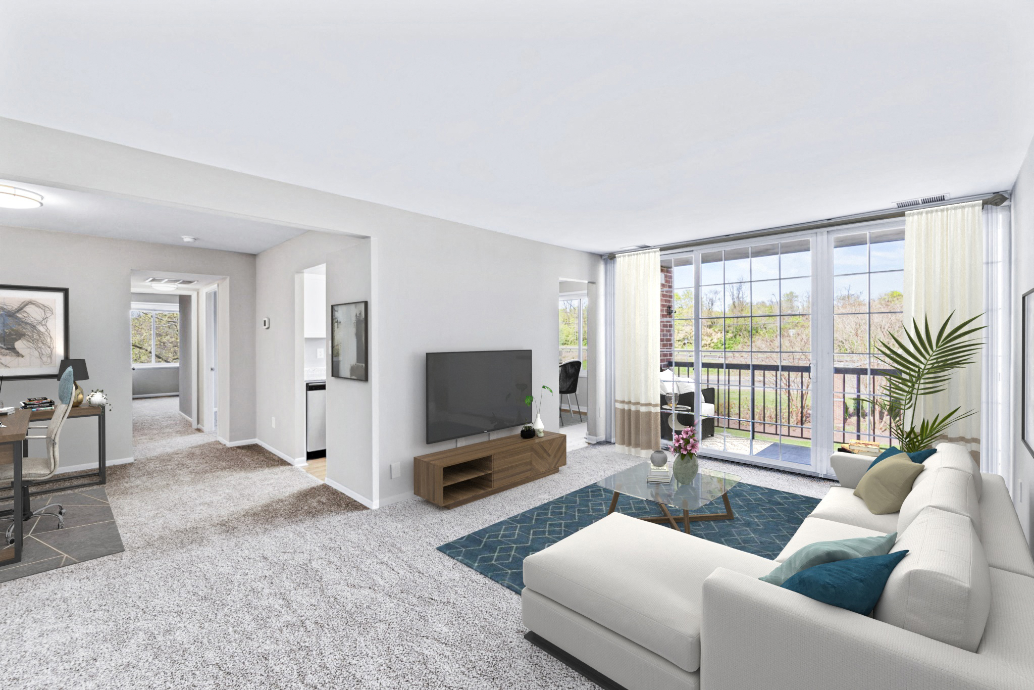 a living room with a white couch and a television