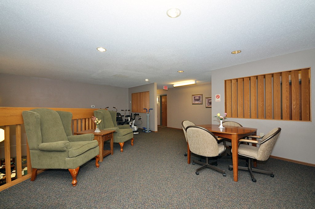 a living room with couches chairs and a table