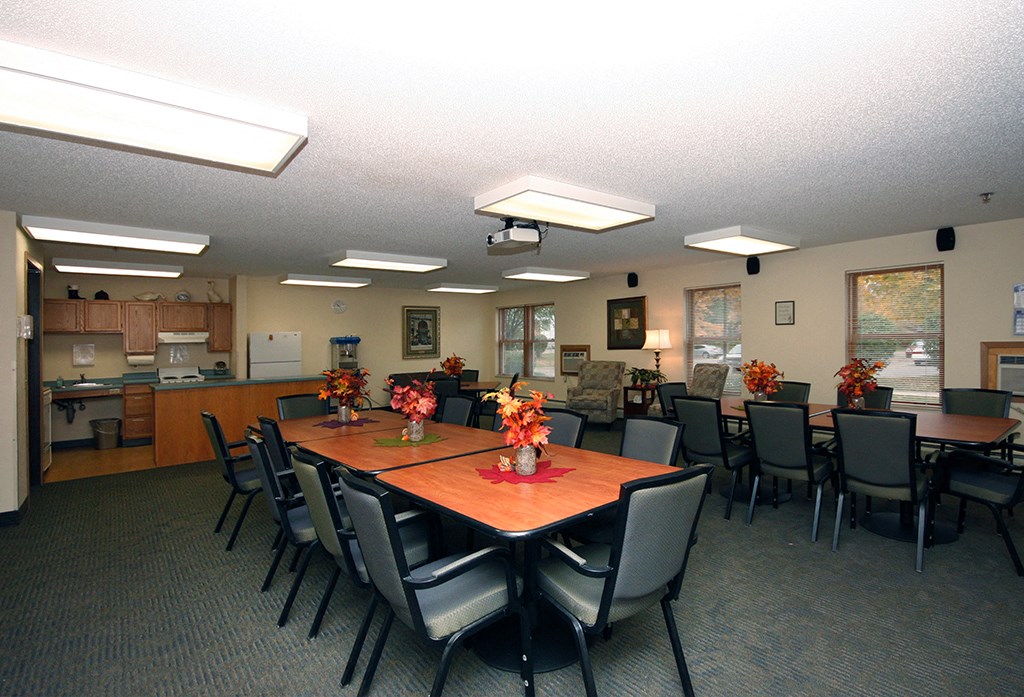 a conference room with a large table and chairs