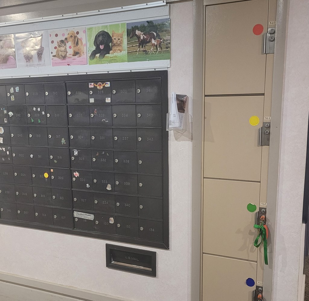 a bulletin board and a calendar on the wall of a classroom