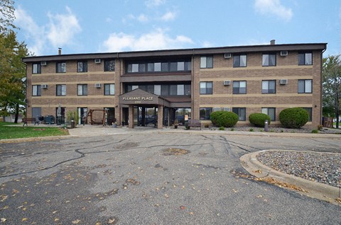 an office building with an empty parking lot