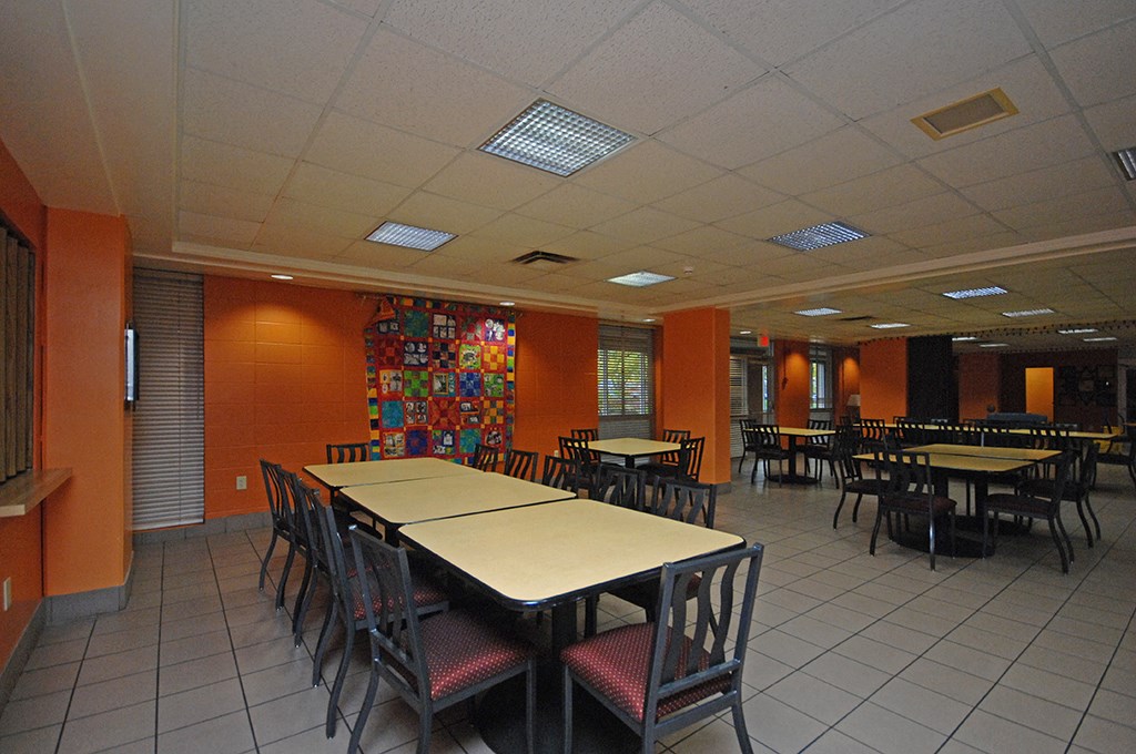 a dining room with tables and chairs