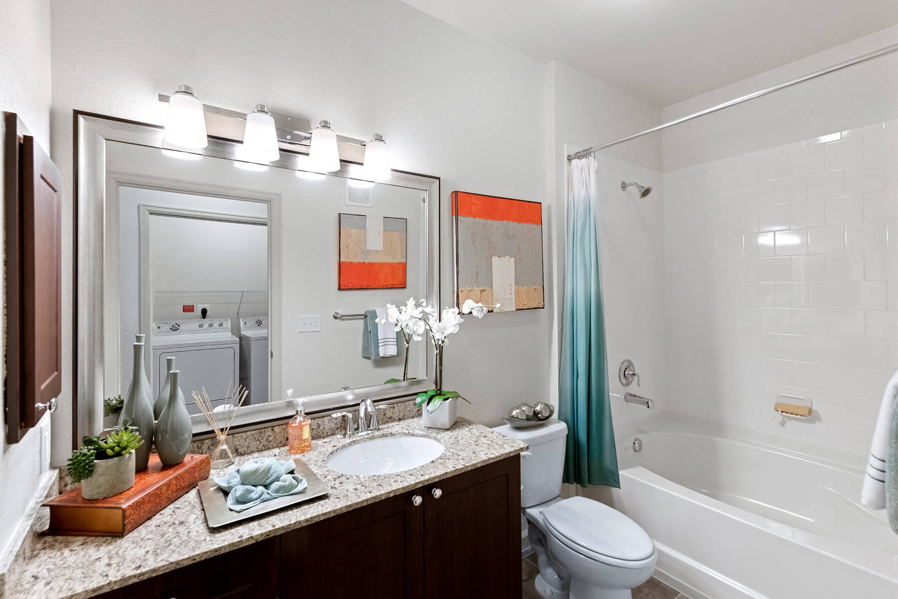 Bathroom with shower tub combo at Atley on the Greenway Apartments in Ashburn VA