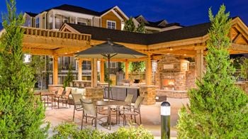 Poolside bbq grills and picnic area at Atley on the Greenway Apartments in Ashburn, VA
