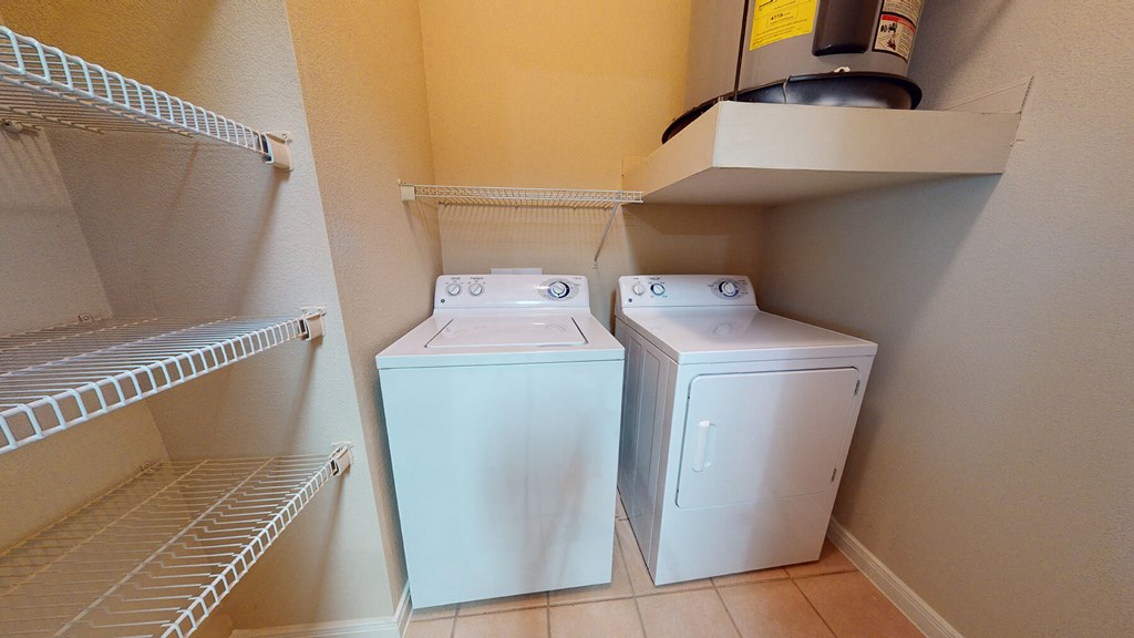 a washer and dryer in the laundry room