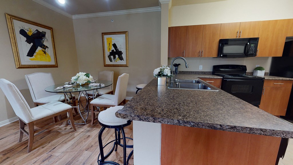 a kitchen and dining area in a 555 waverly unit