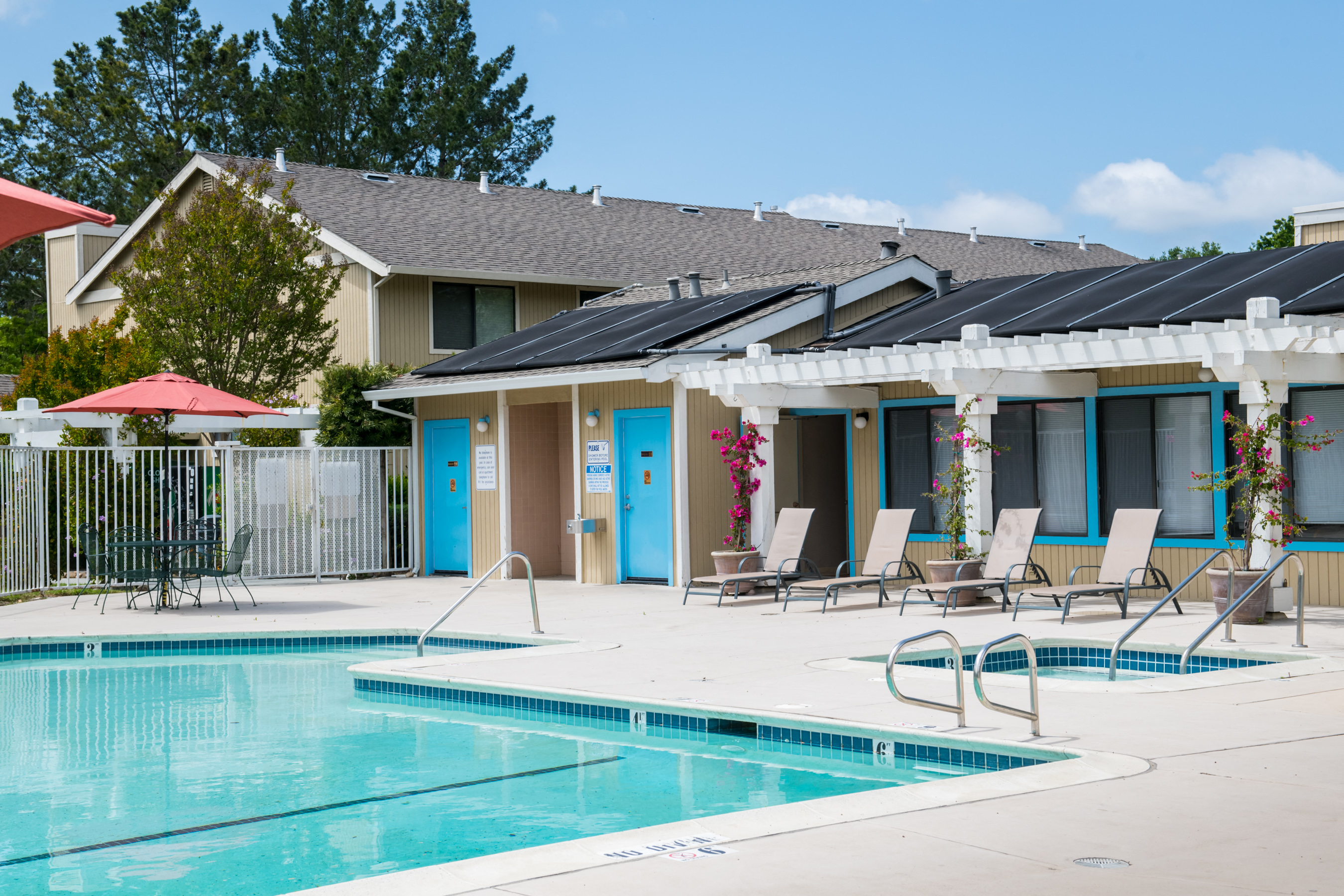 our apartments have a swimming pool and a patio with chairs