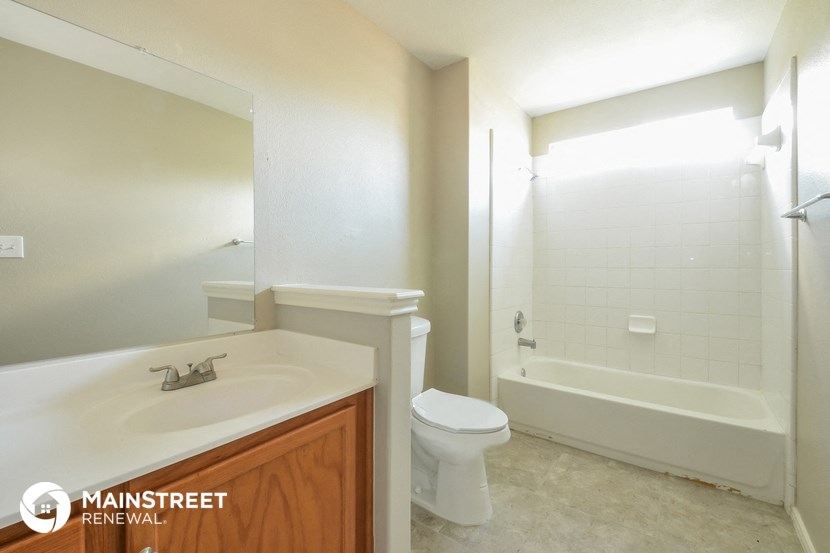 a bathroom with a sink toilet and a bath tub