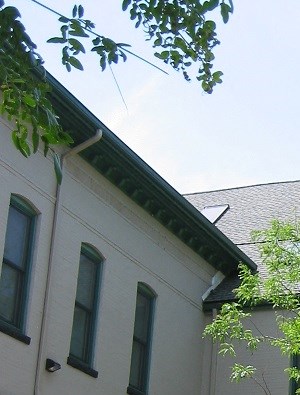 a white fence in front of a building
